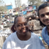 Simon and friend in India at an outdoor laundry. (Photos courtesy of
