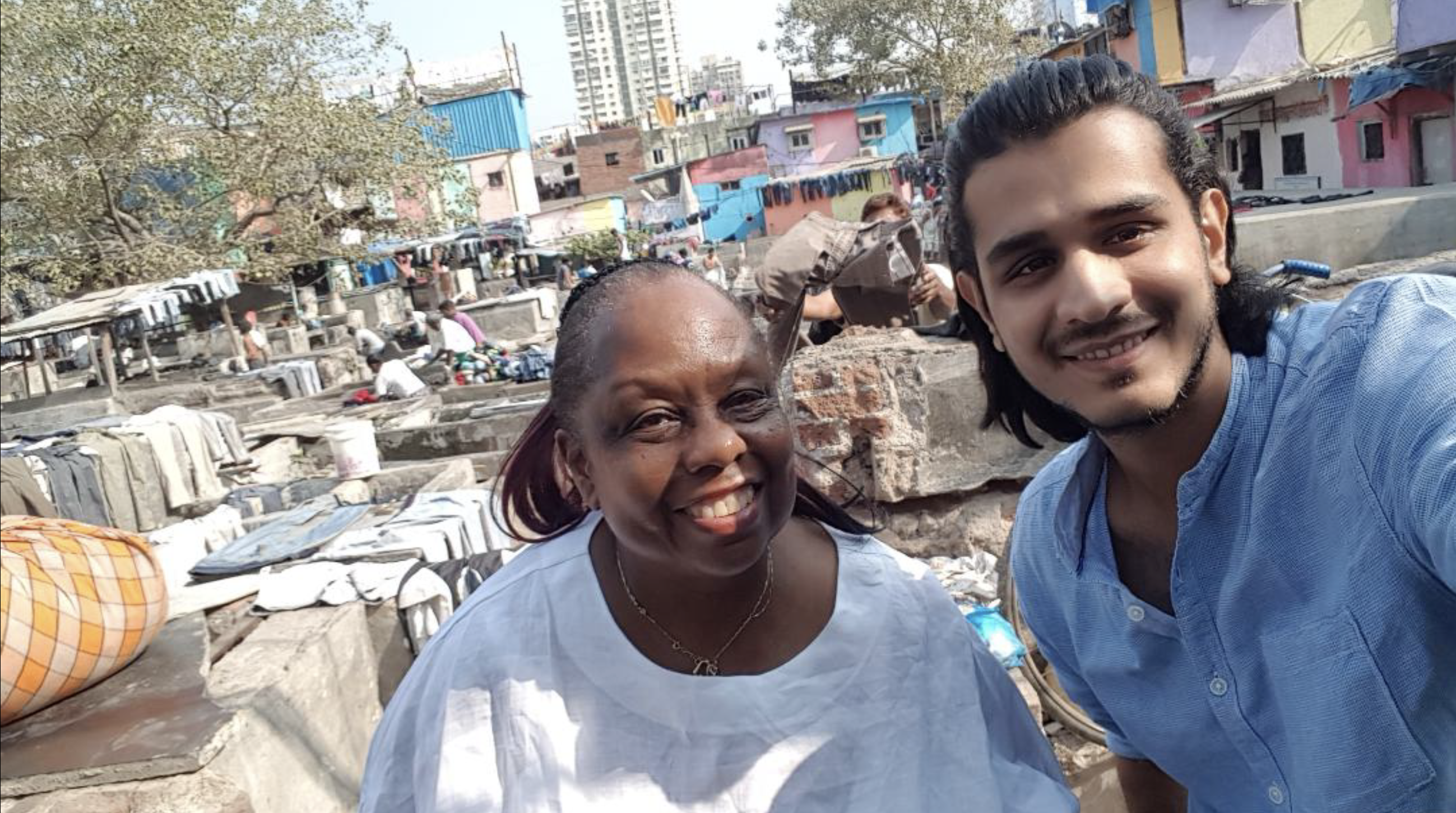 Simon and friend in India at an outdoor laundry. (Photos courtesy of