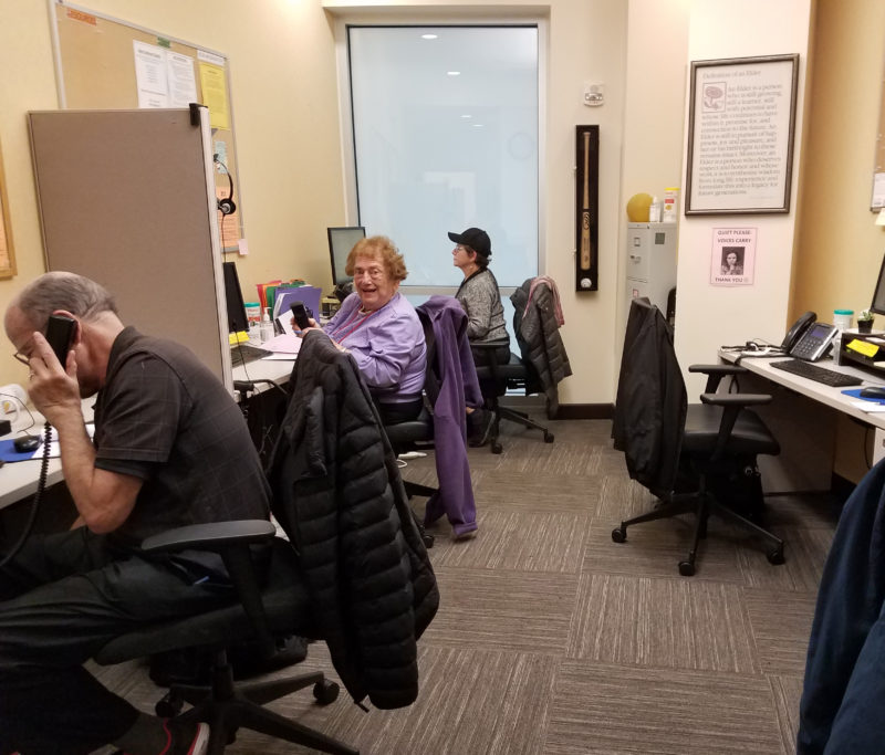 Volunteer Shirley Edelson takes calls at the Friendship Line. (Photo by Judy Goddess)
