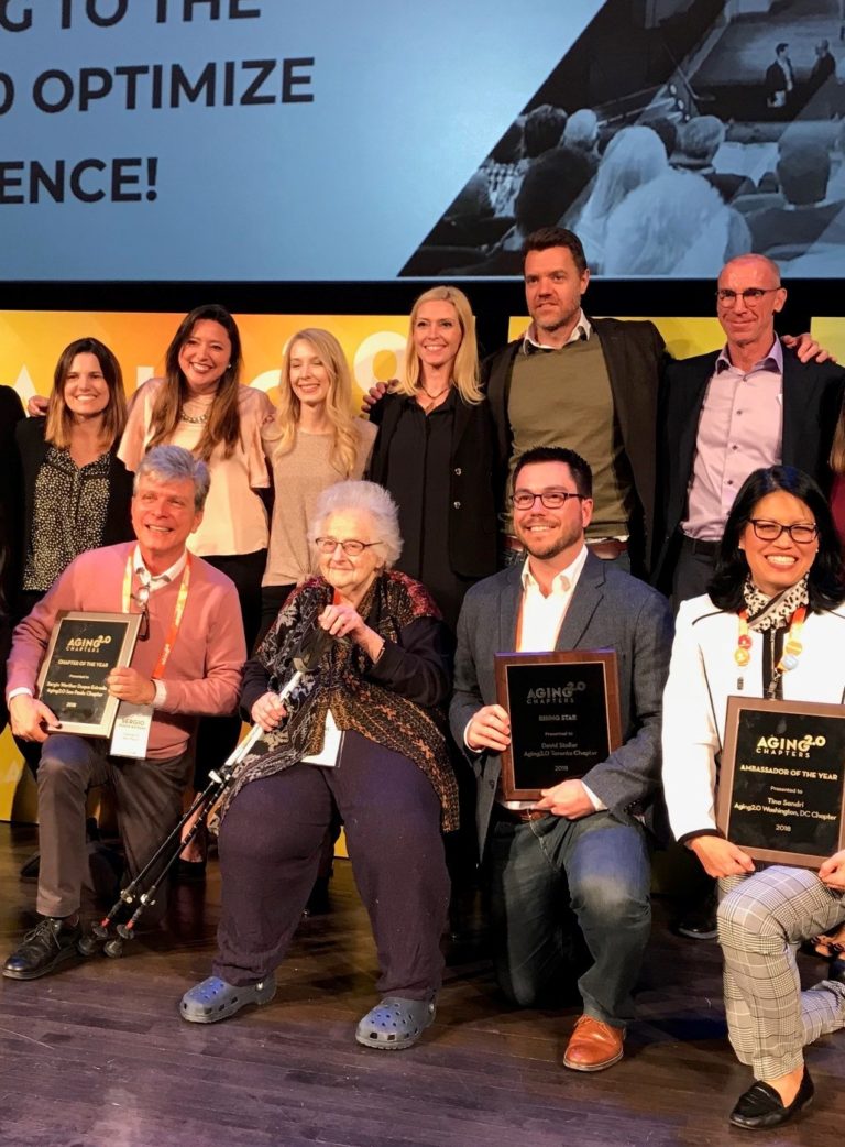 Dr. June Fisher, center, surrounded by Aging 2.0 staff. She was presented at the conference with the organization's 2018 Leadership & Influence Award.